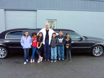 Kids posing with limo